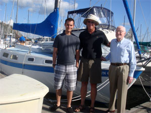 Chris Ackerman, his father (right) and son (left) and their Cal 28