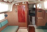 Pearson 25 Salon and V-berth - Salon with custom fold-a-way table, teak and holly sole, and neat and clean interior
