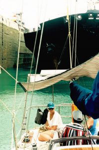 a sailboat transits the Panama Canal