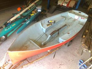 The stripped-out hull is ready for reconstruction. The fiberglass components were kept to maintain hull shape and stiffness.