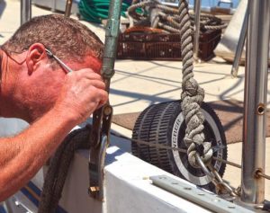 Inspecting a shroud with 10X loupe tosleuth out possible metal faults.