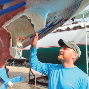 the authoradmiring his progress on
a berglass repair job on
Fulmar, his 1982 Paci c
Seacraft 37.