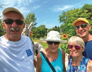 the author, middle, with herhusband, Larry Beneway, left, and friends
Judy Hartman and Gary Hartman on a
day of respite in Cobourg, Ontario.