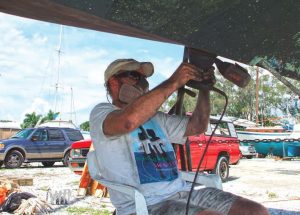 A hot day in Cortez, Florida, when the author vowed tonever sand the bottom of a boat ever again.