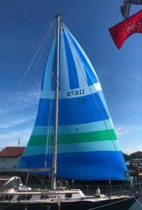 the recut spinnaker now has a better shape for reaching, and is lighter and easier to handle.