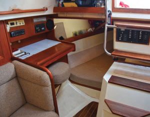 a dedicated nav station is unusual in a 30-foot boat; the swing-out stool permits easier access to the quarter berth.