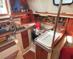 The compact galley has everything a cook needs to prepare tasty meals, and the U-shape provides security in a seaway.