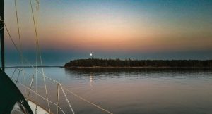 A full moon rises over Black Island.