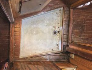 the boat’s originalcabin sole shows damage near the upper
right corner of the shower pan