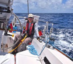 Rick at the helm just north of Maui, with2,700 nautical miles to go.