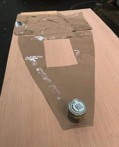 Tom laid the template on a 4 x 8-foot piece of luan plywood for tracing.