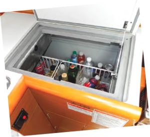 The icebox is set in thecounter between the sink
and stove. Wire racks help
organize contents.