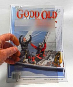 The author holds a section of repairedvinyl that has spent a year in the sun. The
Tear-Aid tape (top), is nearly opaque and
not very strong. The Gorilla tape (middle)
is clear and a little stronger, but is still
weak and has a visible pinked edge,
while the Scotch Book Tape (bottom)
became stronger over time, did not
yellow, and is nearly invisible.
