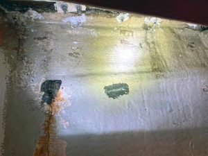 a view inside the port bulkhead before the workstarted shows a rusty drip at the corner of the embedded
chainplate assembly.