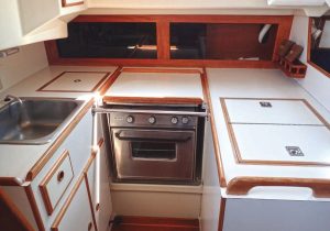 The original galley layoutof the Pearson 365 included a small, 9-inch sink and adjacent deep storage cabinet.