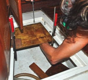 The author bolts in the epoxied plywood support.