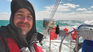 The author is all smiles as SeaLah roars down Lake Erie in a frosty northeast wind.