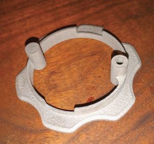 After printing a plastic pawl lockout for 3-speed Lewmar winches, the author had a stainless steel version made for longevity.
