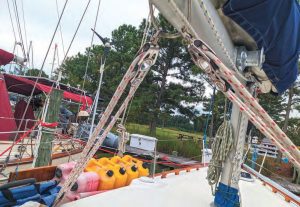 Each block and tackle connects via aboom bale through-bolted to the boom.