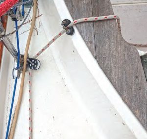 A cam cleat facilitates easy sheeting, allowing one person to tighten or loosen each side.