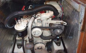 Creating a snorkel of inexpensive bilge hose attached to the air filter intake keeps the alternator cool while putting amps into the batteries.