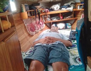 The author takes a nap during the storm, before the boat’s V-berth was soaked with encroaching rainwater.