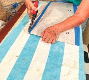 Tin snips proved to be the easiest tool to cut the newlaminate.