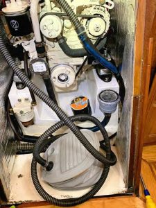 Bert’s dinghy foot pump and hose,attached with a nylon adapter and proper-sized hose clamp to the raw-water intake hose, can quickly clear the saildrive’s inaccessible intakes