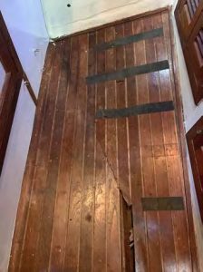 Despite its substantialconstruction, the original floor in this
well-used storage compartment began
cracking.
