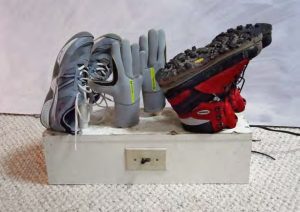 Gloves, sailing shoes, andhiking boots are perched
on the PVC risers atop the
dryer.