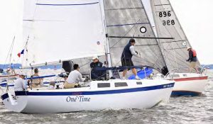 The One More Time crew in action in Annapolis at the nationals: James Yano on foredeck, Larry Robertson on main, Josh Oviedo (Scott’s nephew) nearest mid-pit, Scotty Melendres (Scott’s son and downwind driver) on the rail, Scott Melendres aft trimming and calling tactics, and Art Melendres driving, at right. Photo by Will Keyworth.