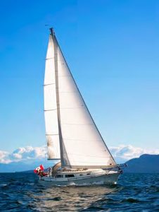 Natasha under sail. When the engine overheated, Bert and Carey opted to sail to their rendezvous, enjoy their evening, and work on the problem while at anchor the next day.
