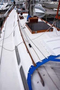There is plenty of teak on deck, including toerails, deck hatches, Dorade boxes, handrails, and cockpit coaming. After years of sanding and varnishing, Scott had the teak stripped and applied Awlwood, a two-part clear finish from Awlgrip paints