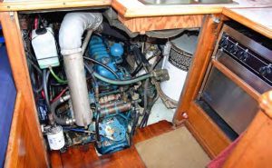 Viewed from the galley, the engine compartment with the exhaust riser is on the left side and water heater on the right,