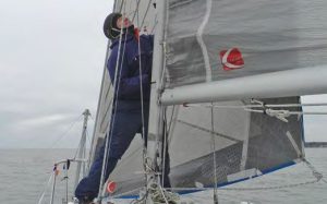 Drew wearing the Zhik H1 while workingat the mast. With a balaclava under it, he
doesn’t even know it’s there.