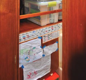 The kids’ boat school arts exhibitioncurrently helps decorate the shelves as
seen from inside the head