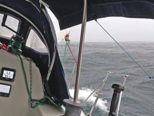 Secret Plans sails through somerain and fog off the Nova Scotia Atlantic coast last
summer, at right.