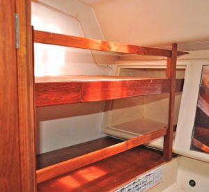 Dini bolstered the support for the uppershelves by extending the wood for the
cleats into a cupboard for toiletries,