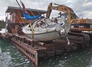 The boat aboard the barge after beinglifted from the island, underway to the
mainland.