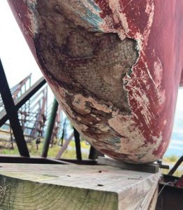 After the cruise was over, Tom finally sawthe nasty results of two close encounters
with the submerged rock known as Hen
and Chickens off the mouth of
the Connecticut River.