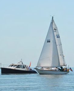 Tomfoolery clears the Essex Yacht Clubcommittee boat and crosses the starting
line of the Sam Wetherill Race.
Photo courtesy Essex Yacht Club.