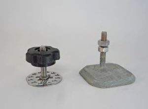The Sea-Lect Designs stud on the leftincludes holes around the base to
enhance adhesion. On the right, this
DIY version is made from Garolite with
a 1/4-inch bolt tapped into it to serve as
the stud.