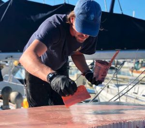 Chris applies fairing compound to the hardtop.
