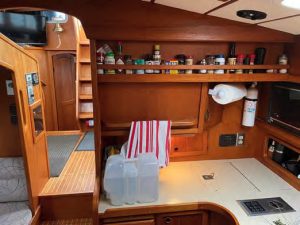 Looking aft from the galley into thesaloon, the steps leading down to the
aft cabin, and the companionway steps
leading to the cockpit