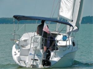 man sailing boat