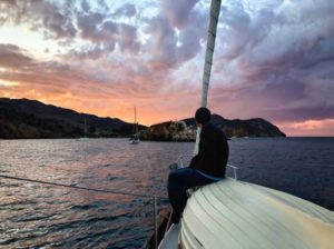 man viewing sunset from boat