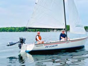woman and man on sailboat