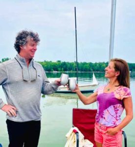 man and woman toasting