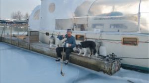 man and dog in winter