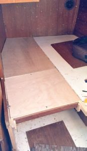constructed queen-size berth on boat